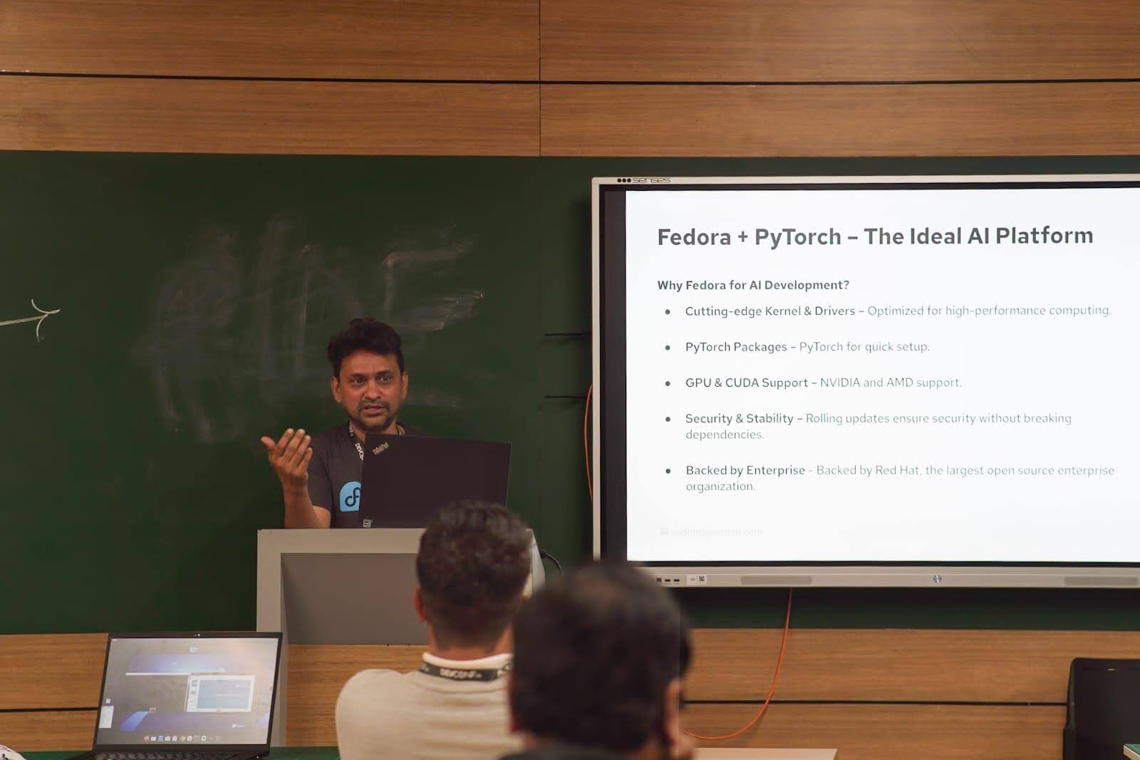 man speaking at a conference