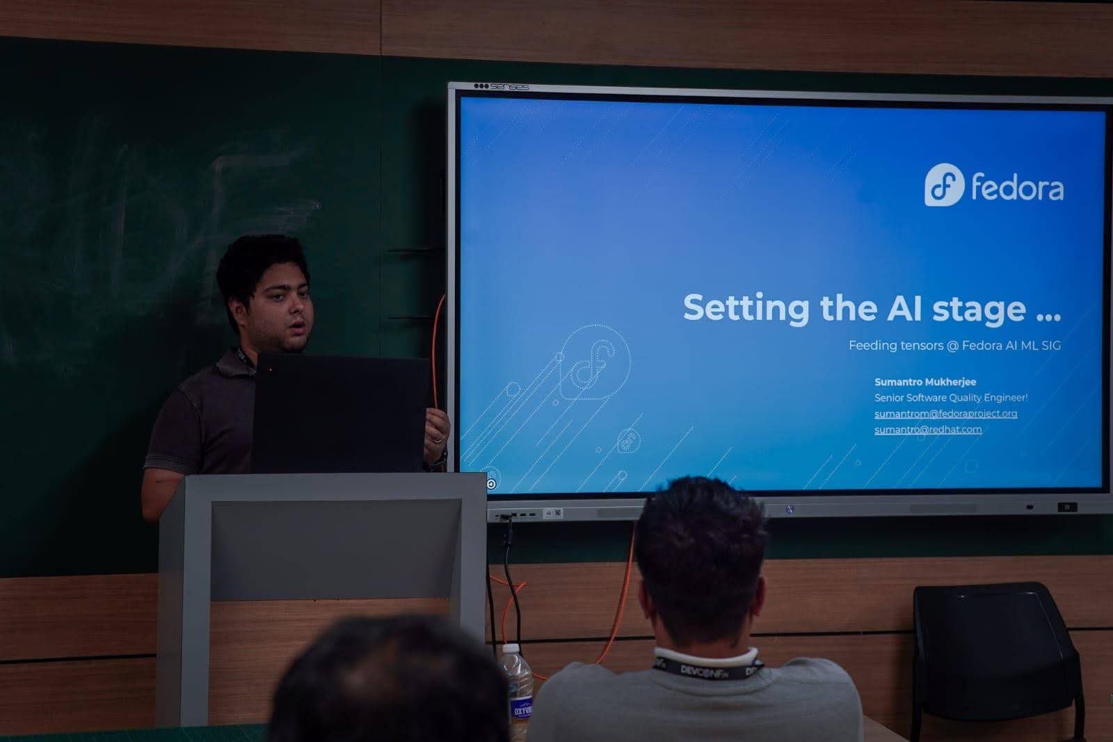 man speaking at a conference